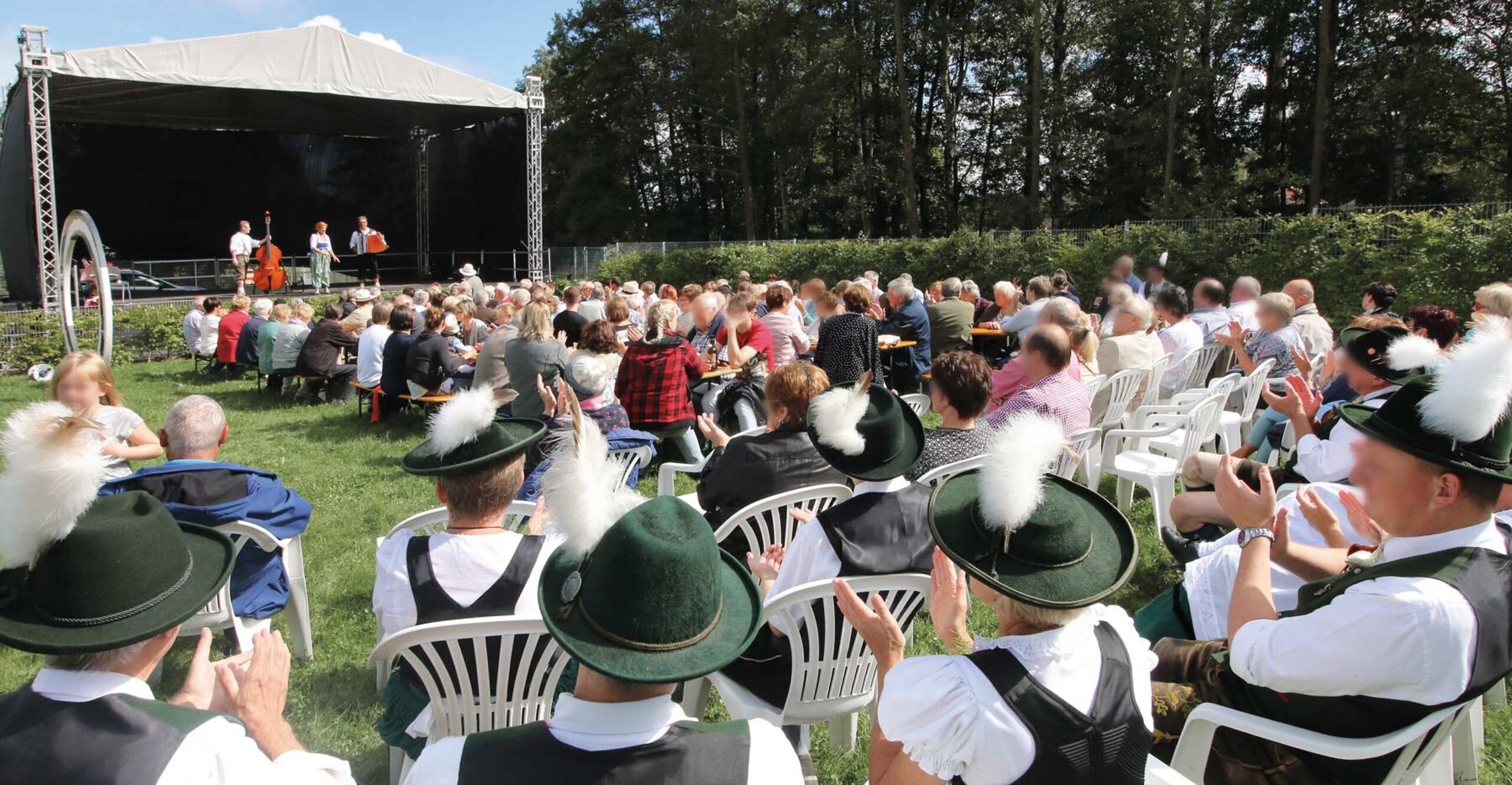 visitors of a party are looking at the stage